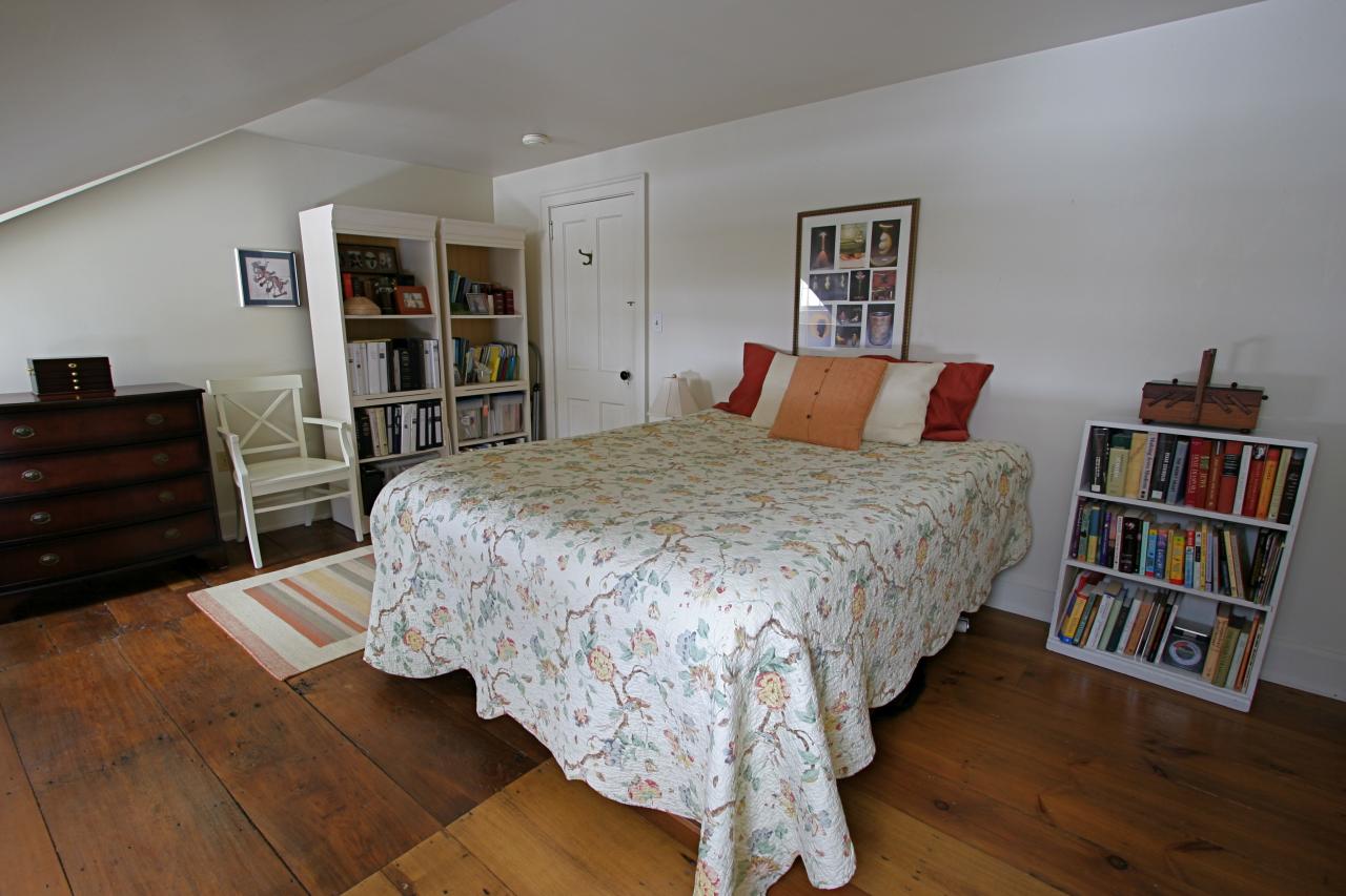 454 Main Road, Unit 8 Monterey, MA 01245 - Photo 14 of 22 a bedroom with a bed furniture and a book shelf