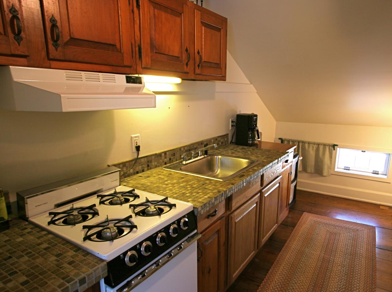 454 Main Road, Unit 8 Monterey, MA 01245 - Photo 16 of 22 a kitchen with a stove and a sink