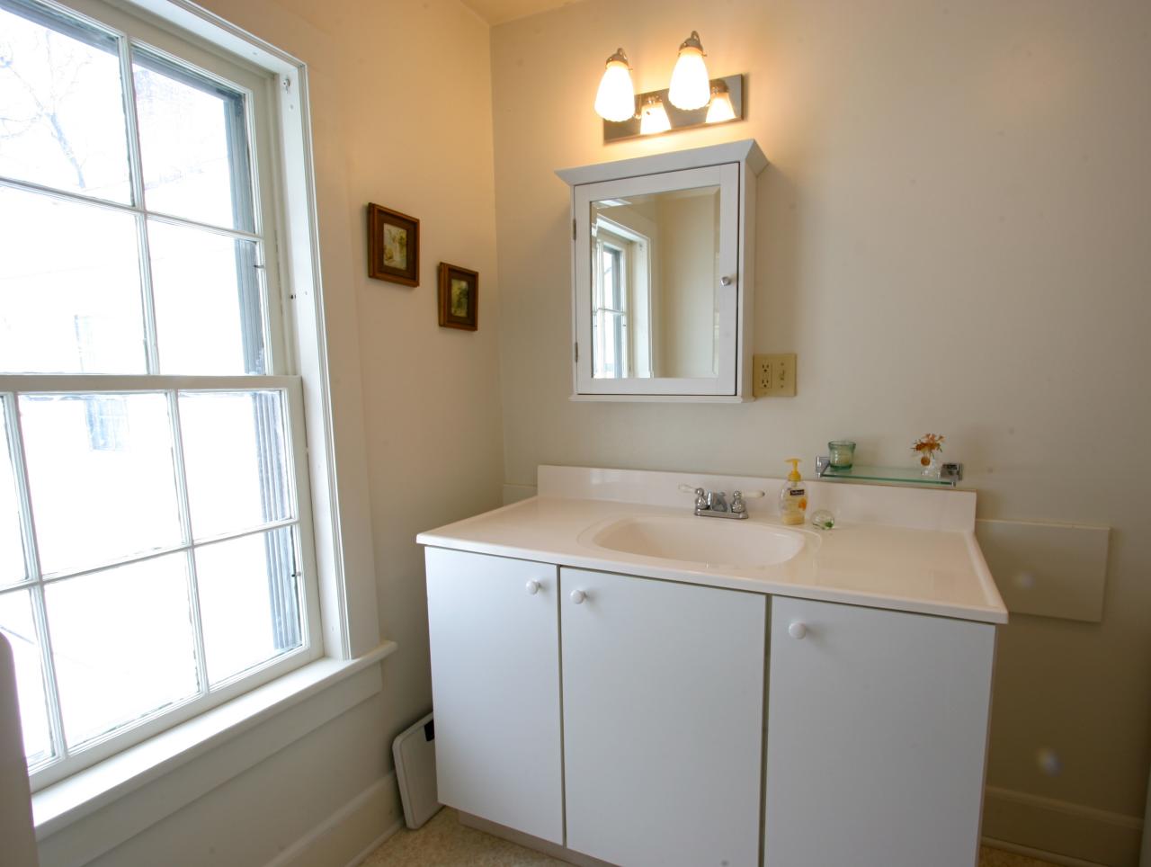 454 Main Road, Unit 8 Monterey, MA 01245 - Photo 18 of 22 a bathroom with a sink a vanity and a mirror