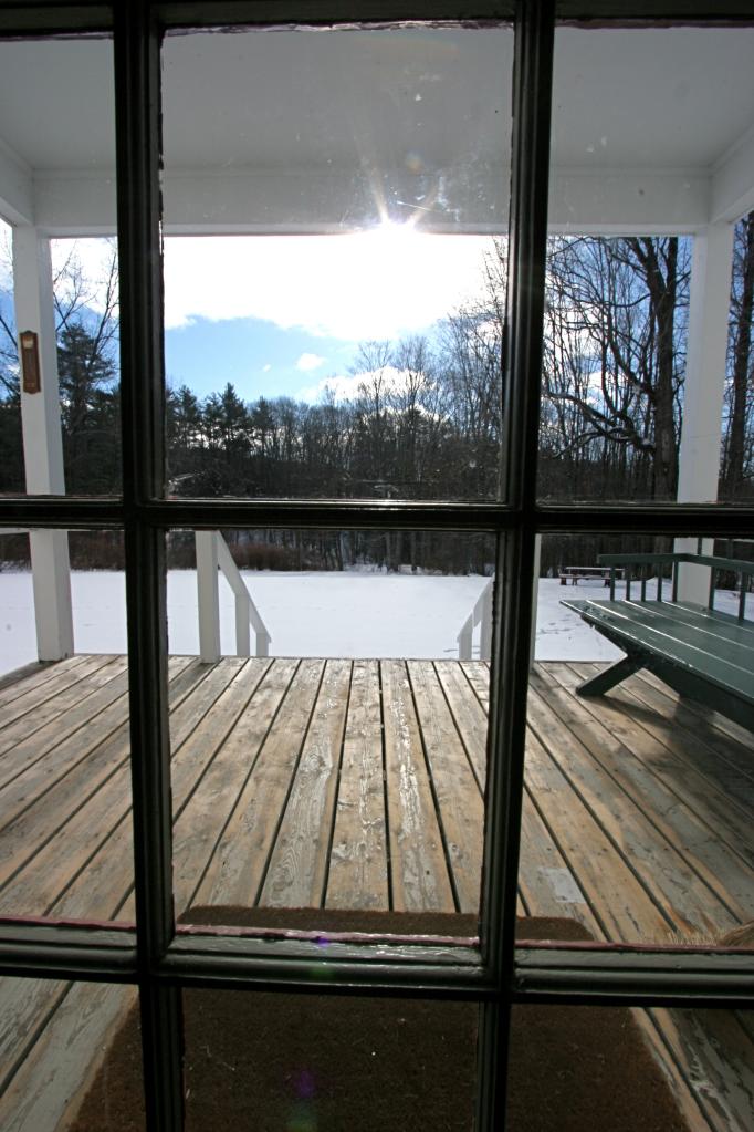 454 Main Road, Unit 8 Monterey, MA 01245 - Photo 19 of 22 a view of a balcony with wooden floor