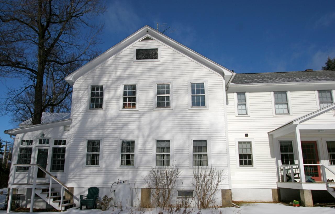 454 Main Road, Unit 8 Monterey, MA 01245 - Photo 3 of 22 a view of a white house with many windows