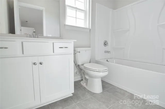 a bathroom with a toilet and a sink