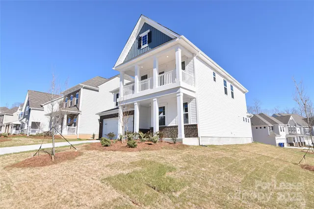 a view of a white building with a outdoor space