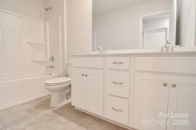 a bathroom with a toilet a sink and a bathtub