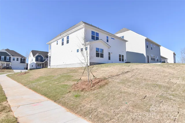 a big house with a big yard and large trees