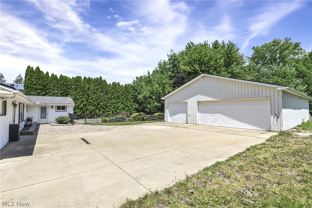 301 Crosse Road Amherst, OH 44001 - Photo 4 of 49 Concrete driveway and additional parking area.