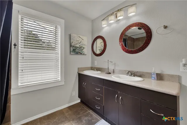 a bathroom with a sink a toilet and a bathtub