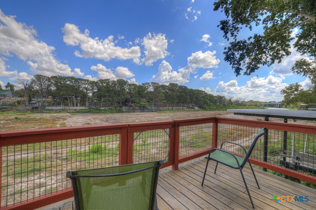 1015 Reiley Road Seguin, TX 78155 - Photo 31 of 41 a view of a balcony with mountain view and wooden floor