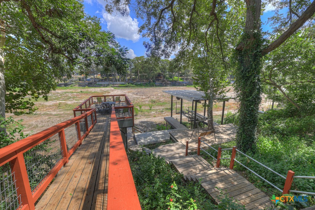 1015 Reiley Road Seguin, TX 78155 - Photo 32 of 41 a balcony with wooden floor and outdoor seating