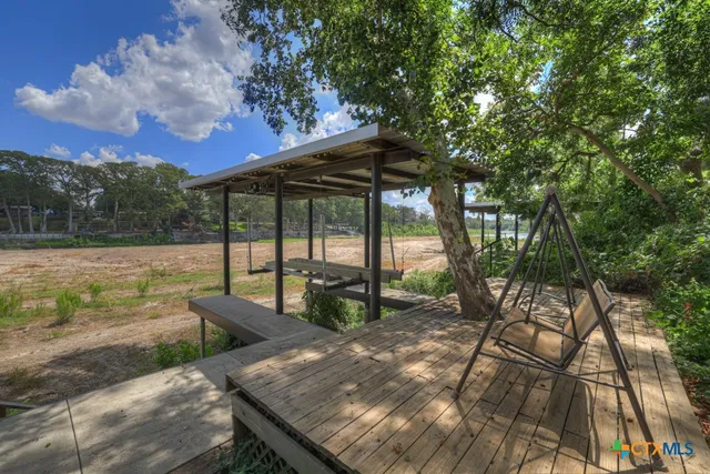 a view of a chairs and table on the terrace