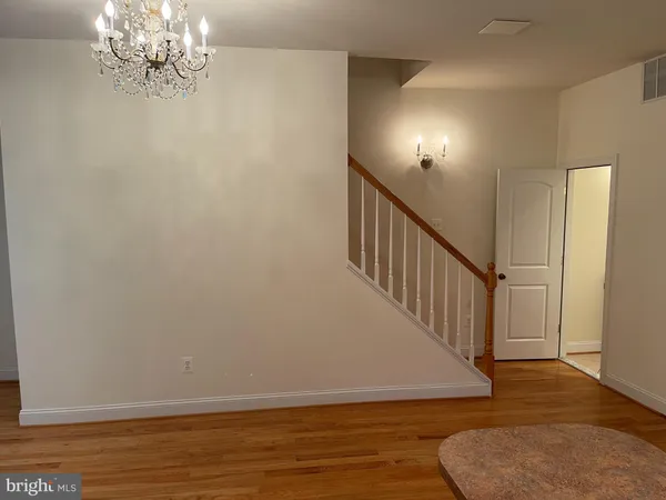 a view of an entryway with wooden floor