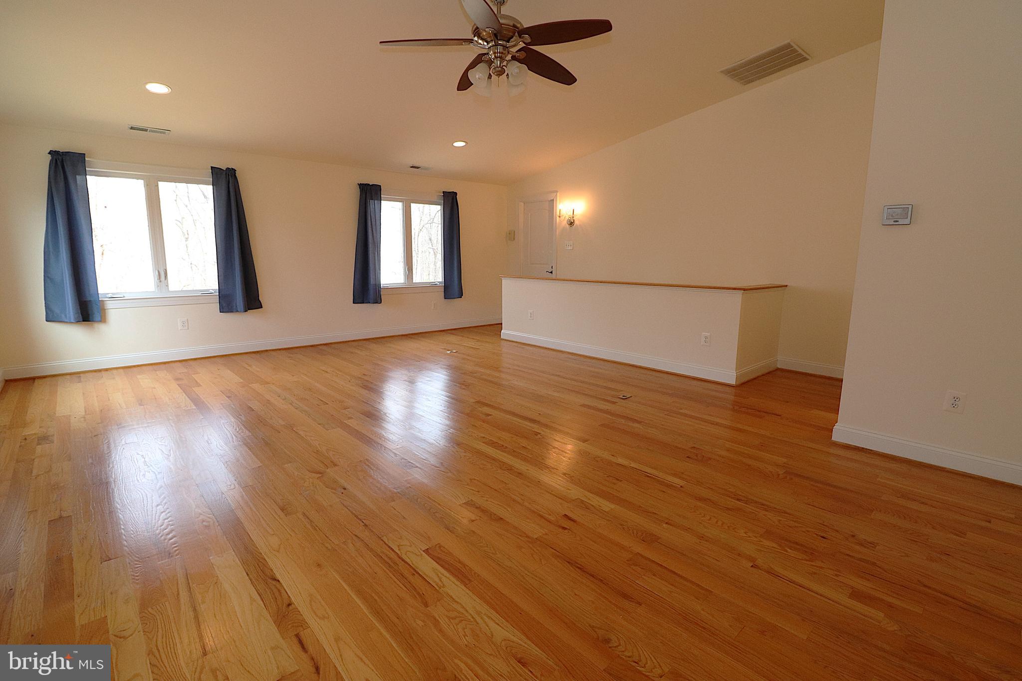 118 Quaint Acres Drive Silver Spring, MD 20904 - Photo 21 of 41 a view of an empty room with wooden floor and a window