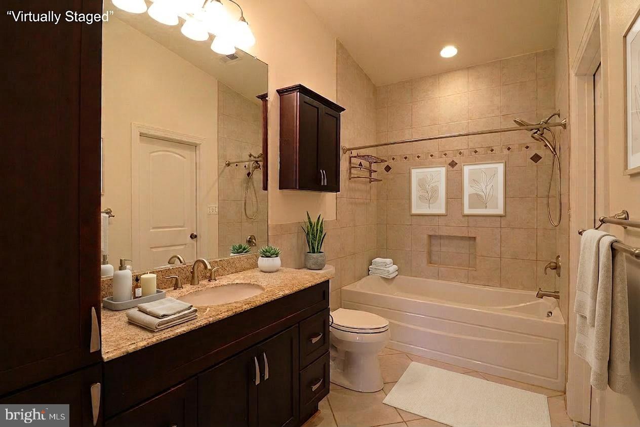 118 Quaint Acres Drive Silver Spring, MD 20904 - Photo 24 of 41 a bathroom with a granite countertop sink toilet and shower