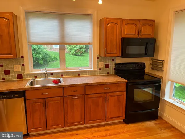 a kitchen with a sink and a microwave