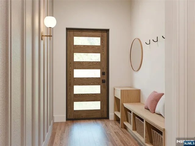 a view of a room with wooden floor and windows