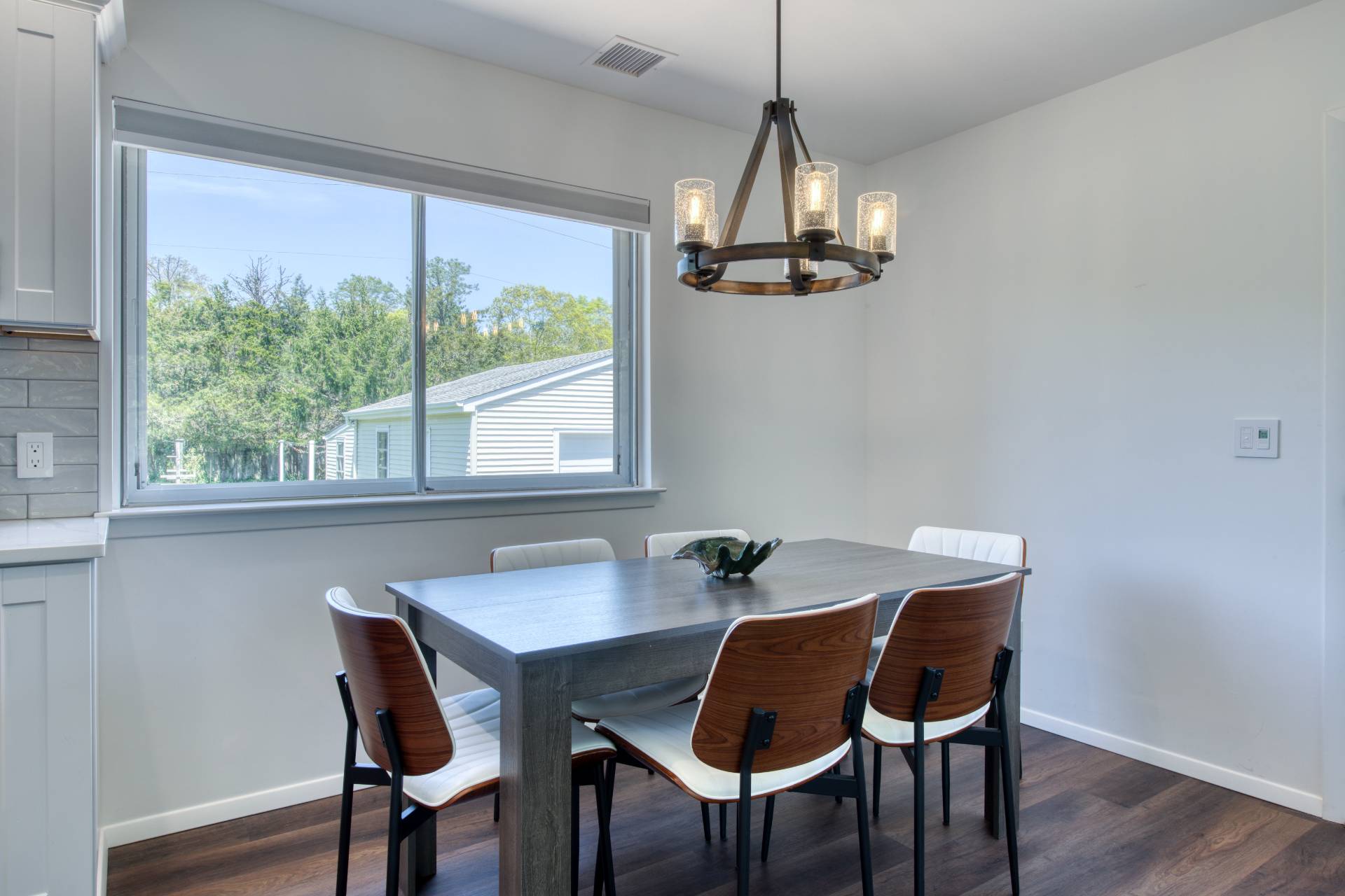 88 Old Country Road East Quogue, NY 11942 - Photo 4 of 10 a view of a dining room with furniture window and wooden floor