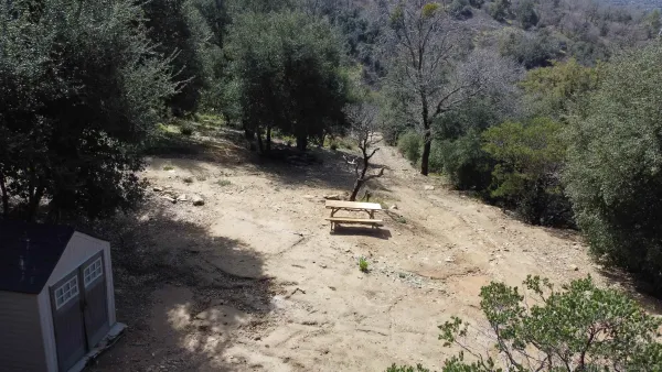a view of a backyard of a house