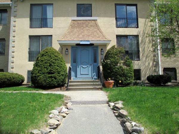 140 Swanson Road, Unit 424 Boxborough, MA 01719 - Photo 1 of 18 a front view of a house with a yard