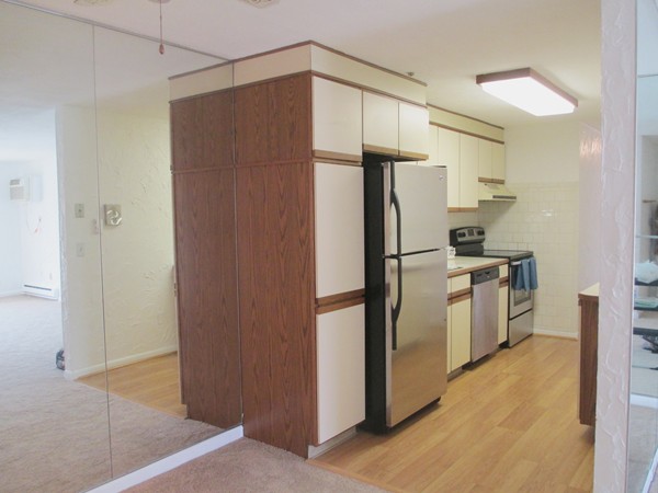 140 Swanson Road, Unit 424 Boxborough, MA 01719 - Photo 5 of 18 a kitchen with a refrigerator and a sink