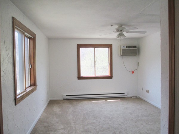 140 Swanson Road, Unit 424 Boxborough, MA 01719 - Photo 8 of 18 an empty room with windows and closet