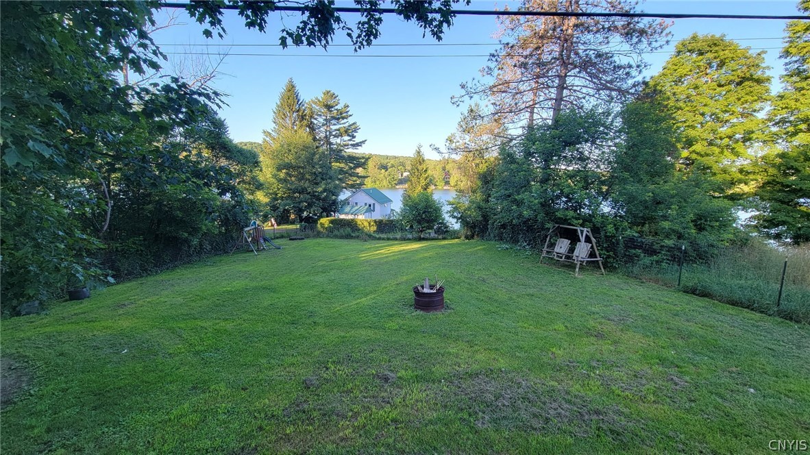 1248 Lake Como Road Summerhill, NY 13045 - Photo 22 of 22 Fully fenced in yard with lake views and fire pit