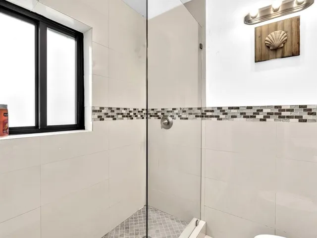 a view of a bathroom with a shower
