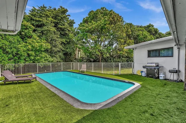 a view of a backyard with a lake view