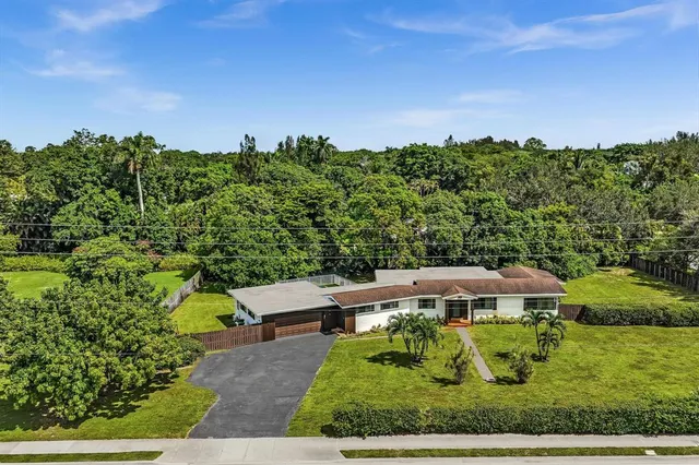 a view of a swimming pool with an outdoor space and seating area