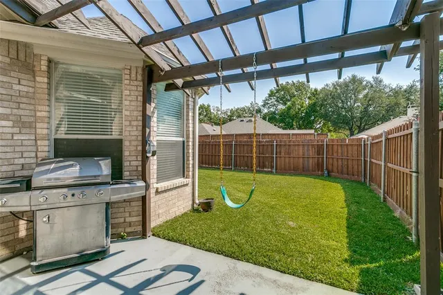 a view of a backyard with plants