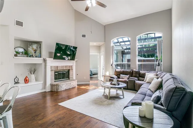 a living room with fireplace furniture and a fireplace