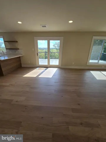 a view of balcony with wooden floor and city view