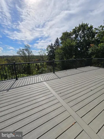 a bathroom with a toilet mirror vanity and sink