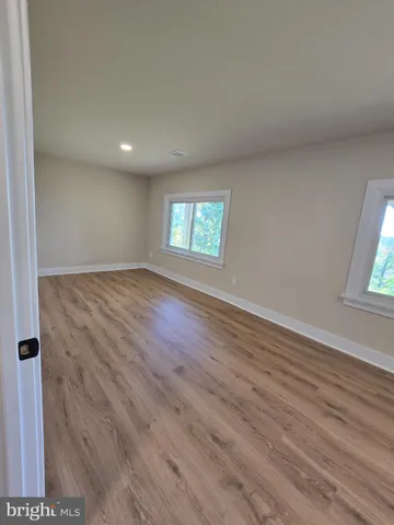 a bathroom with a sink vanity granite and toilet