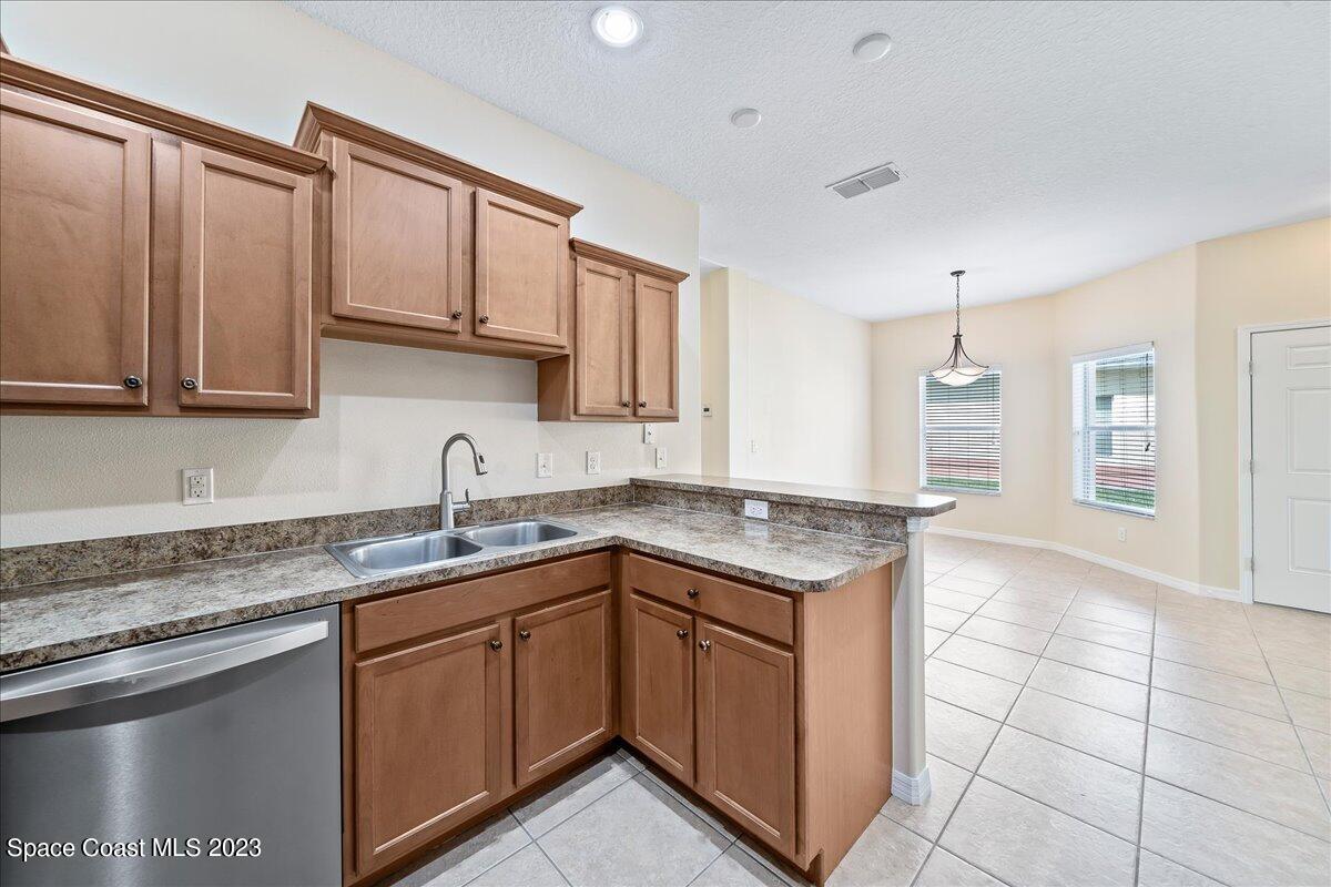3680 Funston Circle Melbourne, FL 32940 - Photo 13 of 48 a kitchen with a sink stove and cabinets