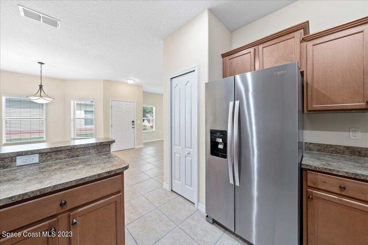 3680 Funston Circle Melbourne, FL 32940 - Photo 14 of 48 a kitchen with stainless steel appliances granite countertop a refrigerator and a granite counter tops