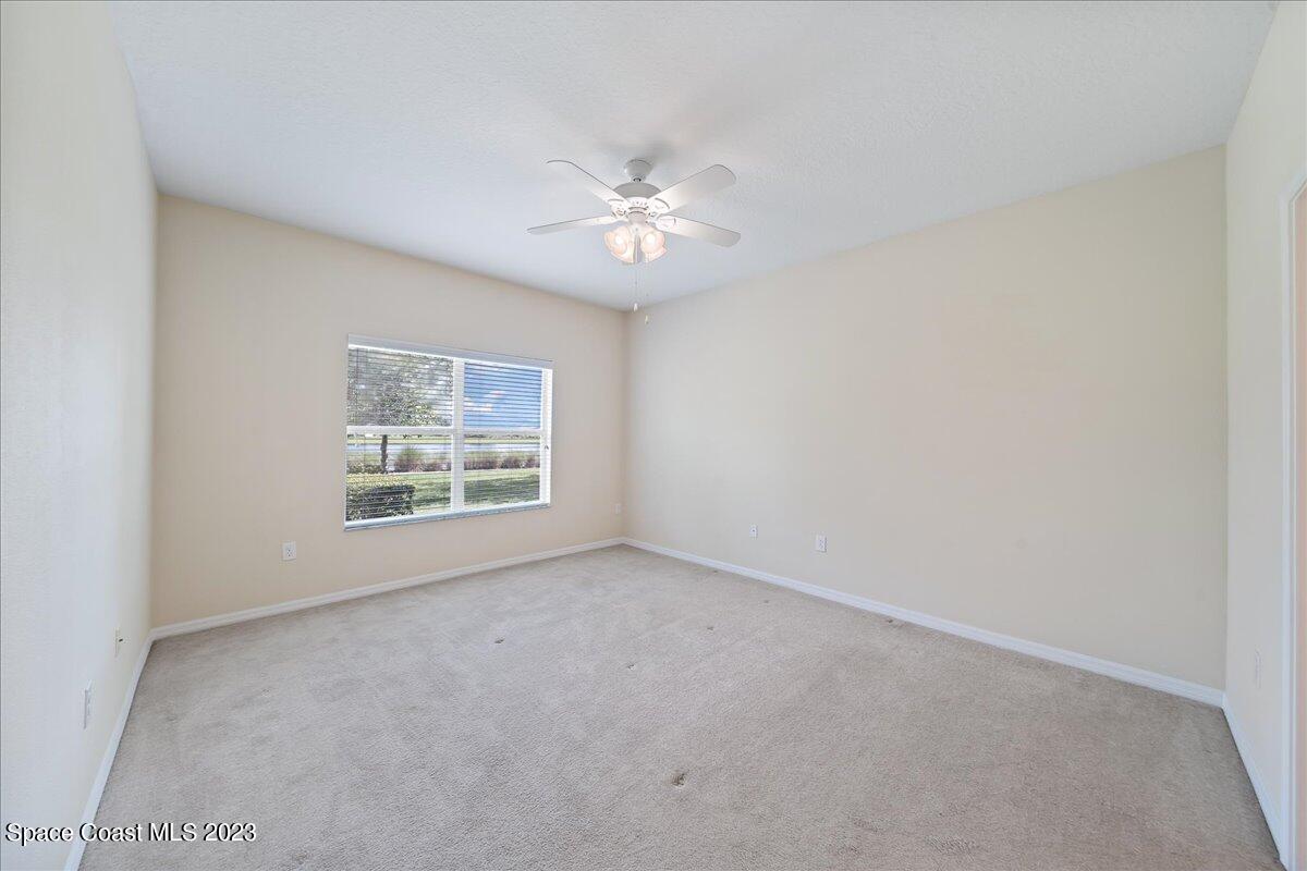 3680 Funston Circle Melbourne, FL 32940 - Photo 15 of 48 an empty room with a window and a fan