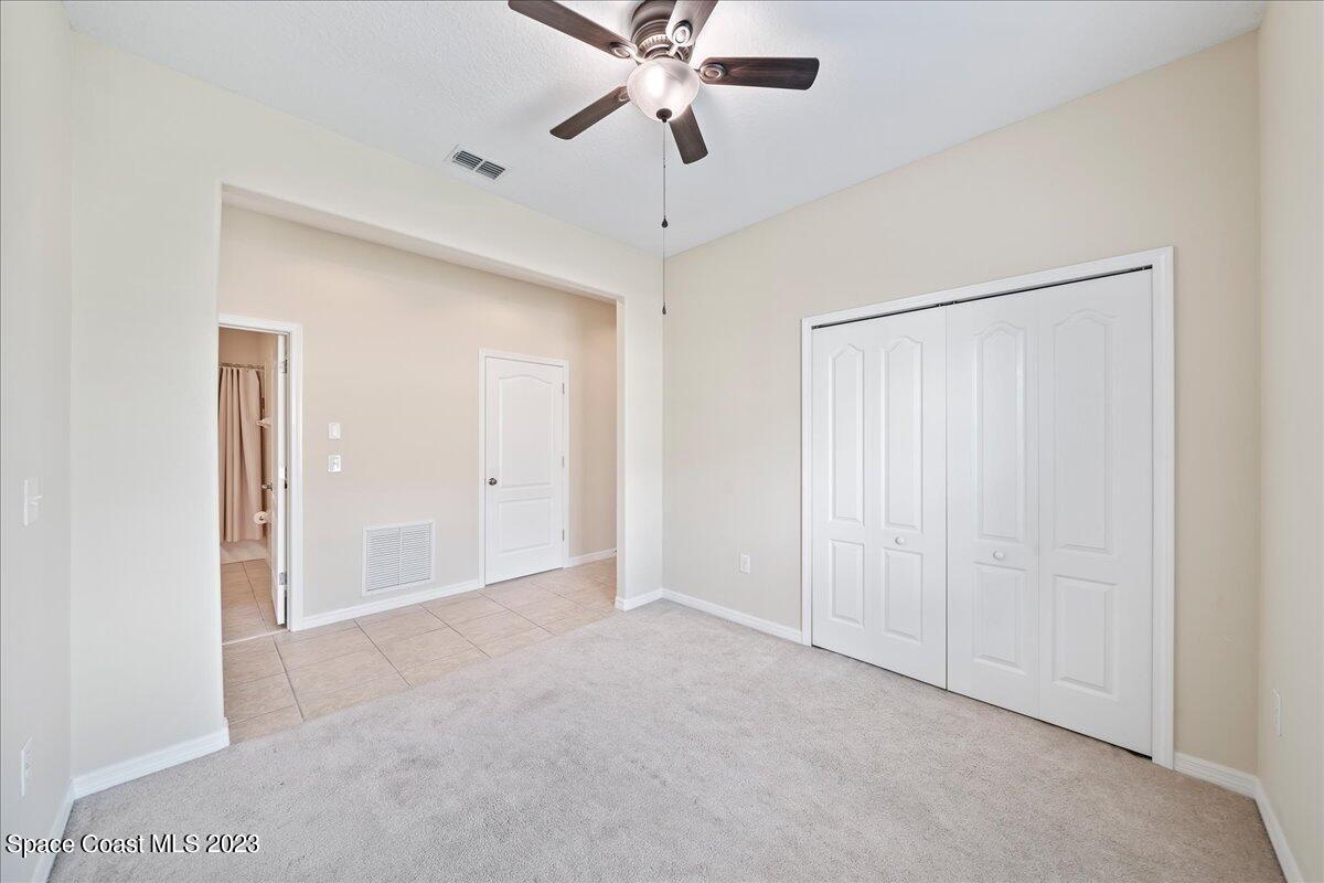3680 Funston Circle Melbourne, FL 32940 - Photo 21 of 48 a view of an empty room with a ceiling fan