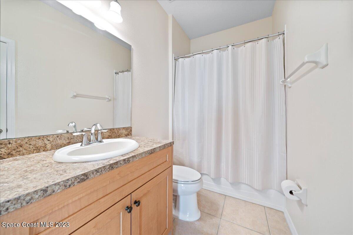3680 Funston Circle Melbourne, FL 32940 - Photo 25 of 48 a bathroom with a granite countertop sink and a mirror