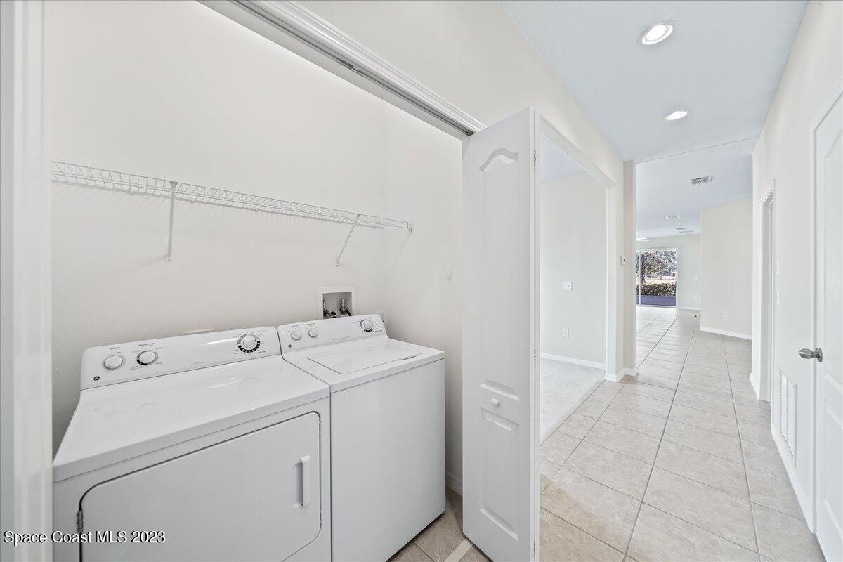 3680 Funston Circle Melbourne, FL 32940 - Photo 26 of 48 a view of storage and utility room with washer and dryer