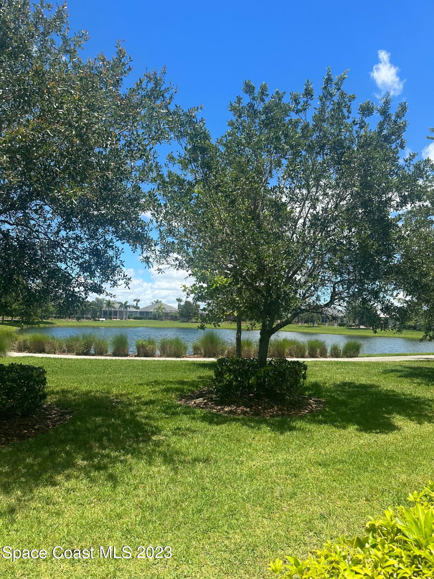 3680 Funston Circle Melbourne, FL 32940 - Photo 3 of 48 a view of a lake from a yard