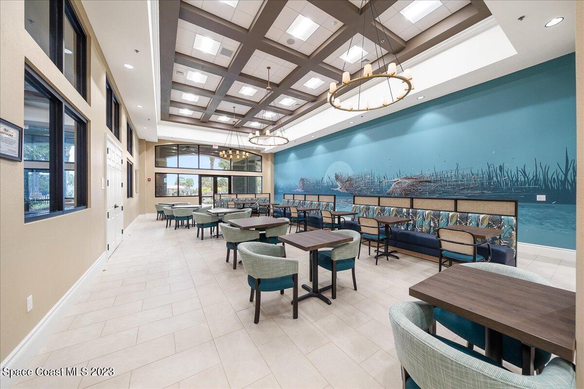 3680 Funston Circle Melbourne, FL 32940 - Photo 39 of 48 a outdoor space with lots of tables a mirror and a rug