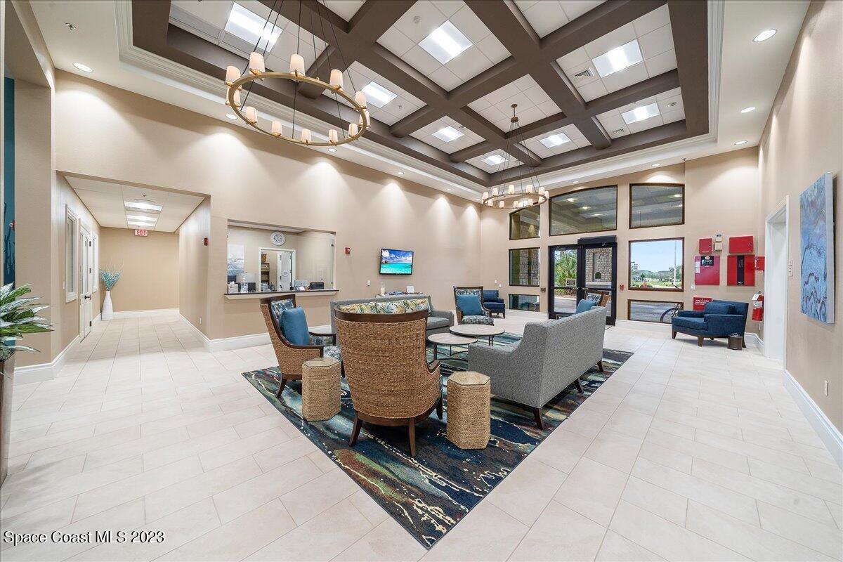 3680 Funston Circle Melbourne, FL 32940 - Photo 44 of 48 a living room with lots of furniture and a chandelier