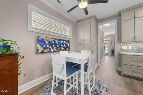 a view of a dining area with furniture and a kitchen