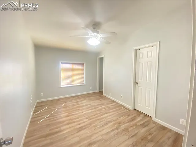a bathroom with a granite countertop toilet a sink and mirror