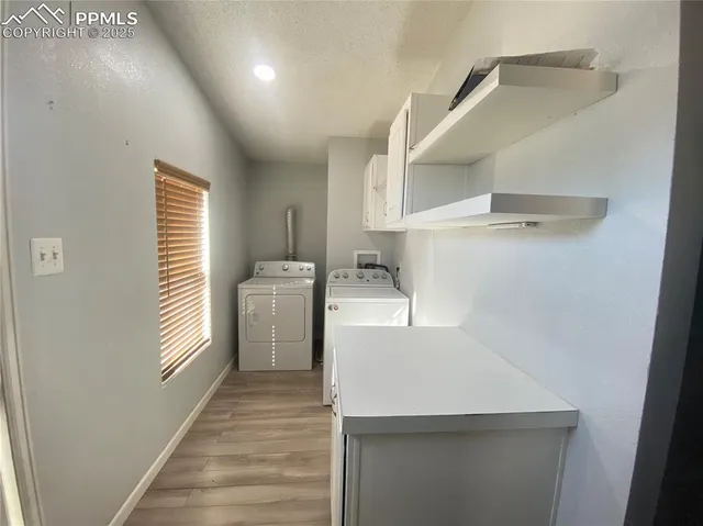 a view of livingroom with furniture and a chandelier