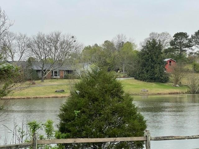 a view of swimming pool with a yard