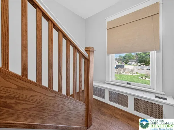 a bed room with furniture and a window