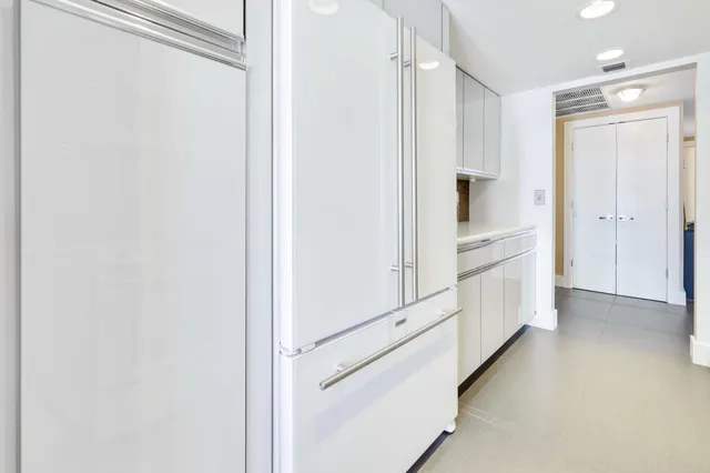 a view of a hallway with white walls