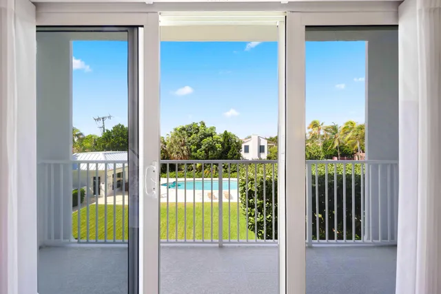 a view of swimming pool from a balcony