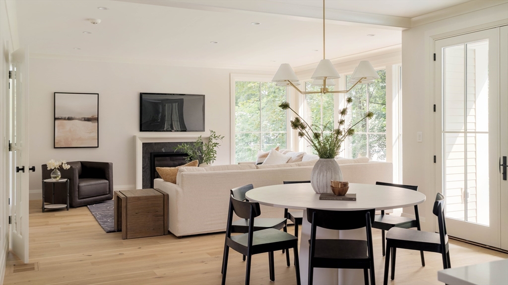 14 Bird Hill Avenue Wellesley, MA 02481 - Photo 17 of 37 a dining room with furniture a chandelier and wooden floor